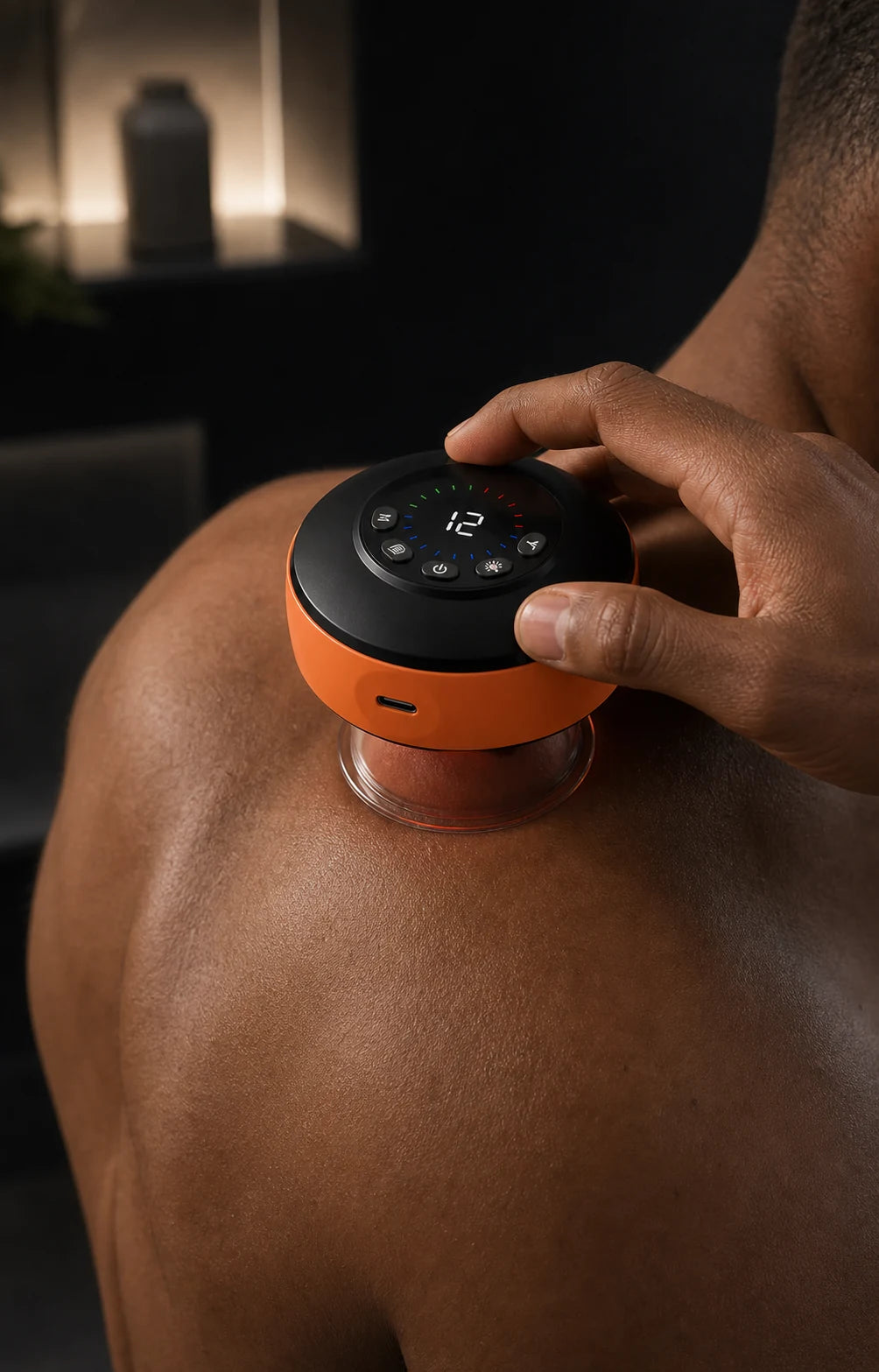 Orange smart cupping device sealed to the upper back by suction